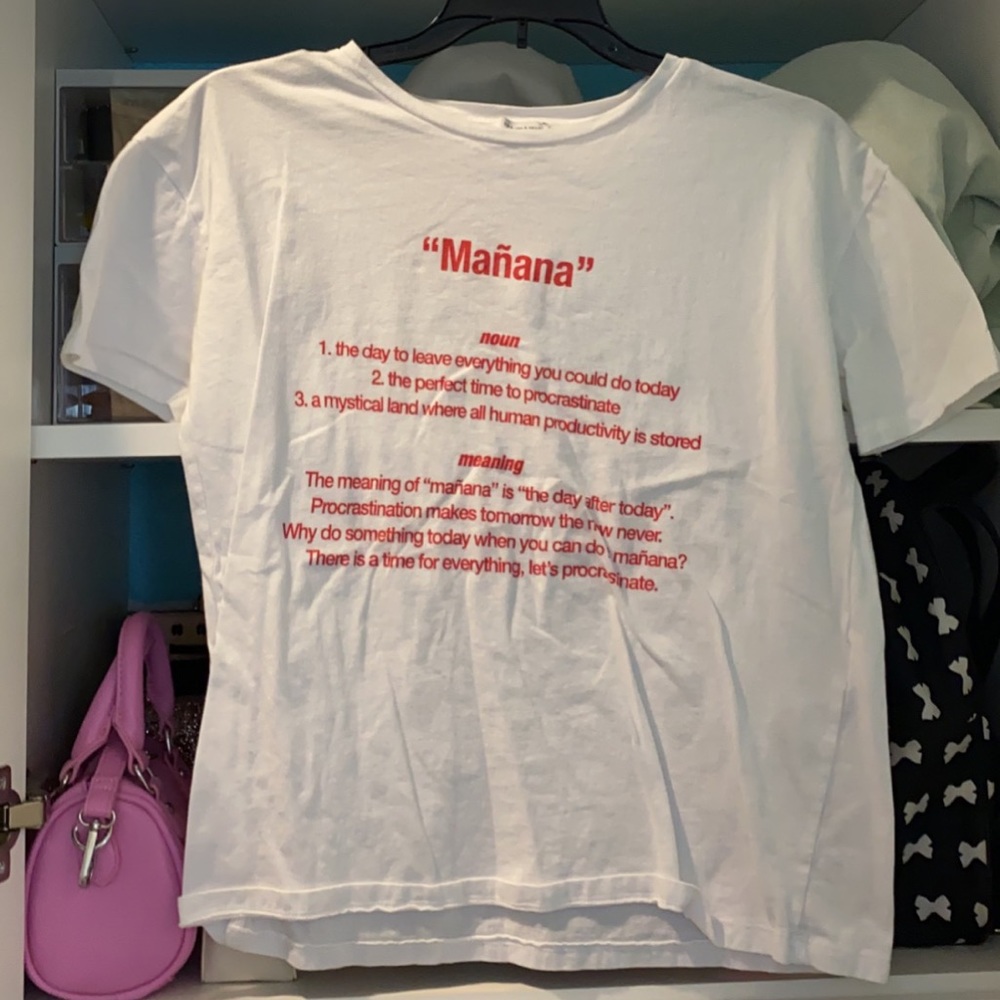 white shirt graphic top with red writing